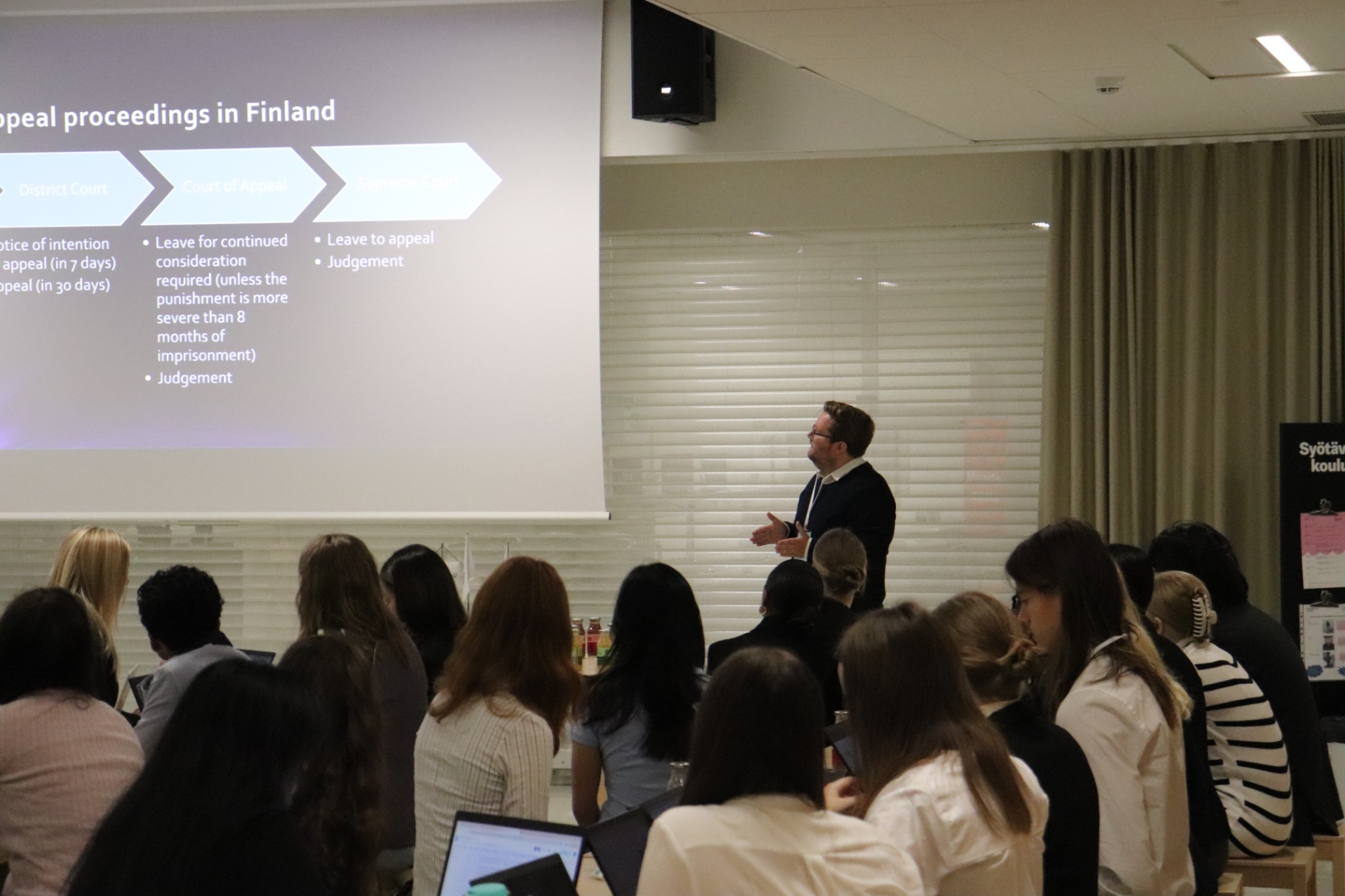 A guest speaker explaining appeal proceedings in Finland at HYMT 2024